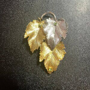 Vintage Goldtone and silvertone Leaf Brooch with green Rhinestones